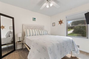 Main floor primary bedroom with ensuite full bathroom