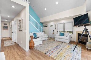 New furniture and paint in the main floor living room that offers gorgeous views!