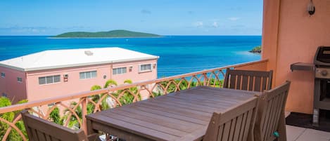 Enjoy meals on your patio with this view of the Caribbean Sea and Buck Island.