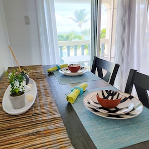 Inside dinning area can seat four people comfortable, looking out into the ocean