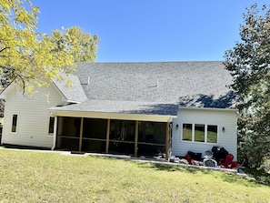 Screened in porch, patio with firepit and gas grill and spacious backyard.