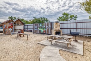 Cabin has its own side patio area with a picnic table, charcoal bbq pit and fire pit