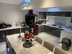 Large kitchen with table to seat 12