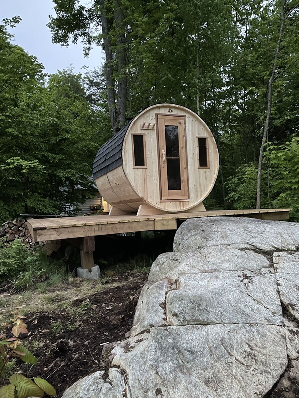 Wood burning barrel sauna for relaxing. Sauna, swim relax repeat! 