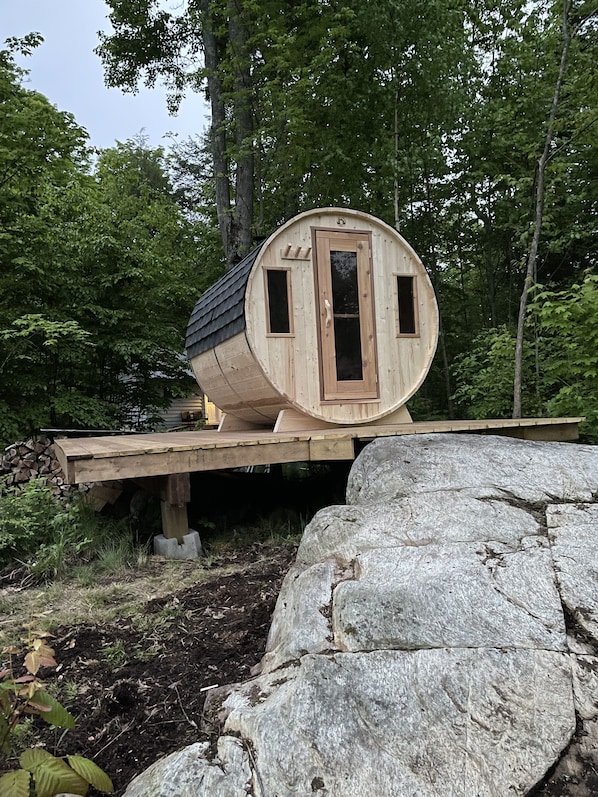 Wood burning barrel sauna for relaxing. Sauna, swim relax repeat! 