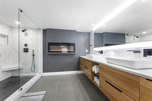 Clean and beautiful bathroom with full length mirror and soft lighting.