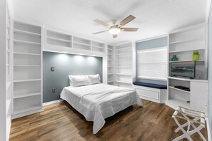 Bedroom is a blend of modern and cozy style.