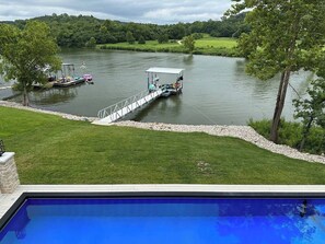 pool, lake, kayaks, paddle boards