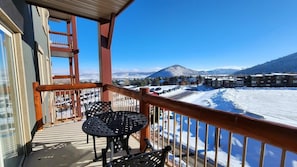 The private balcony off the living room boasts two patio chairs and a small patio table with beautiful views of Canyons Ski Resort and the surrounding valley.