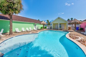 Refreshing oasis-style pool with sparkling water and comfy loungers to enjoy