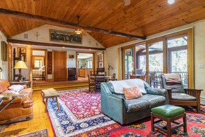 Sunken living room with woodstove.