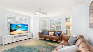 Comfortable living area with big screen Smart TV