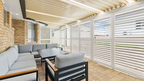 Step outdoors to find the enclosed Queenslander-style entertainment area,