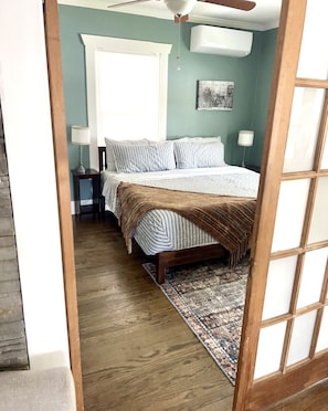 Entrance to Evening Primrose Bedroom with King Bed, Dresser, & closet