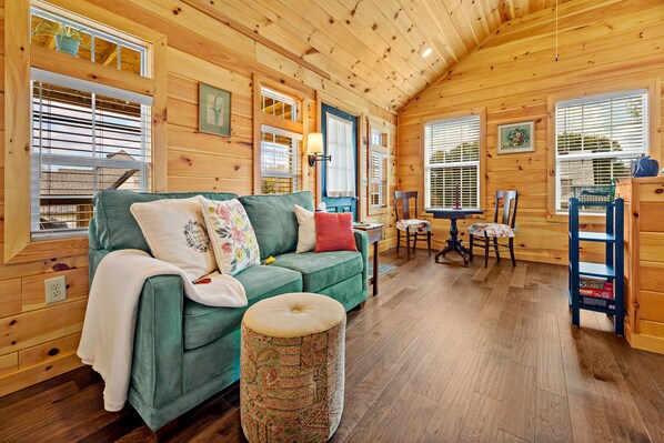Spacious room featuring a Lazy-Boy love seat (full-size sleeper).
