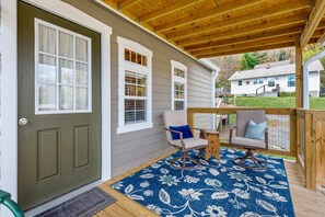 Covered porch to enjoy coffee or a glass of wine.