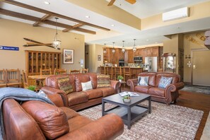 Large open floor plan with vaulted ceilings and wooden beams