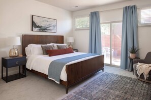 Unwind in ultimate comfort. The master suite boasts a king bed and private backyard access, creating your own personal retreat.