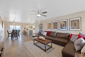 Relaxing spacious living room with 65" smart TV.