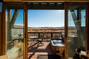 Deck with private hot tub and view of nature preserve