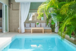 Swimming pool with patio