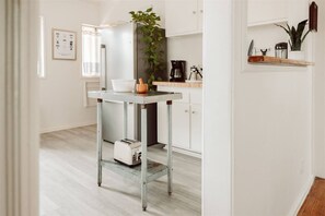 Large open kitchen with all the necessities, including a coffee brew bar with Chemex, french press, Kalita wave, Bona Vita brewer, traditional coffee pot , Hario our over kettle and burr grinder.