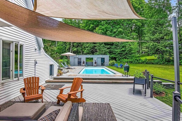 Spacious deck for lounging, bbq-ing and swimming.