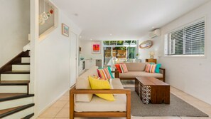 Living area is downstairs, with bedrooms and bathroom upstairs.