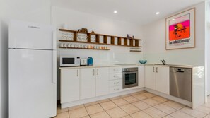 Fully equipped kitchen with a dishwasher, full sized fridge/freezer, oven, cooktop, microwave and Nespresso coffee machine (no milk frother, bring your own favourite pods).