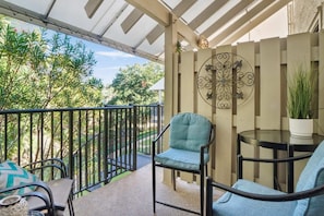 Relaxing Balcony off of the living room has a spiral stair case that takes you down to the Springwood grounds and leads you to the community pool