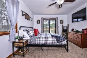 Master bedroom with King bed and beautiful morning lake sunrise