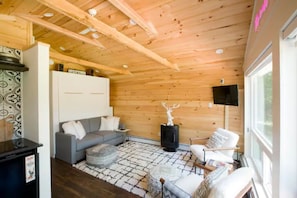 Cozy living room featuring a TV & Bluetooth Edifier /Jamo sound system!