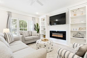 Living room with cozy furniture and fireplace