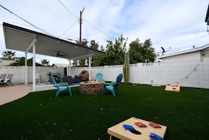 Enjoy outdoor games, serene sounds of the fountain or cozy up by the firepit
