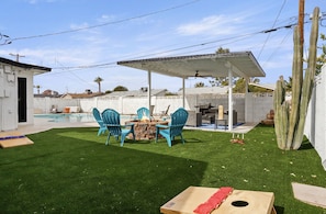 Enjoy the fire pit, outdoor games, serene fountain, outdoor seating and pool.