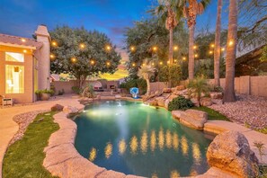 Enjoy the heated saltwater waterfall pool, outdoor dining, seating, 45" TV & BBQ grill