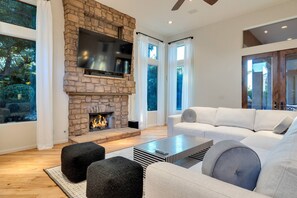 The family room has lots of seating & great views of the backyard