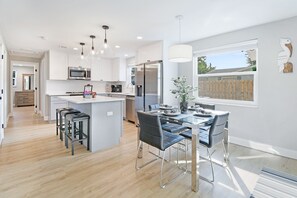 Fully stocked kitchen with all your cooking needs plus a dining room table