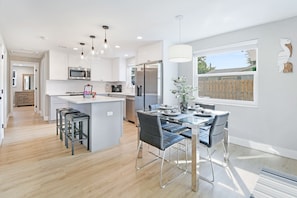 Fully stocked kitchen with all your cooking needs plus a dining room table