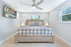 Master bedroom with a king sized mattress + a 50" smart TV (Roku) and bathroom