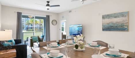 Modern open concept of living room, dining room and kitchen with island!#Disney #Parks #kingdom #springs #StoreyLake #Apartment #Vacation #Rental #waterpark #Kissimmee #Orlando #universal #citywalk