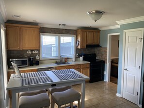 Kitchen and dining area - includes microwave, keurig coffee maker and pods.