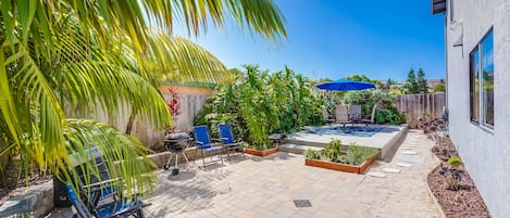 Communal backyard space is shared with other tenants of the property