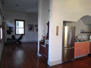 The living room is open to a large foyer area shared with the kitchen.