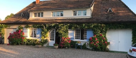 Beautiful view of the house, as you arrive  via gated access to front drive.