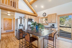 Open Kitchen with Kitchen Island and Bar Seating