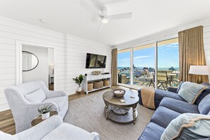 Living room with fantastic gulf views, smart TV, and private patio with additional seating.