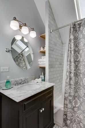 The apartment's bathroom is newly rehabbed