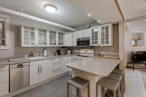 There's plenty of cabinet space in the kitchen, as well as a dishwasher!
