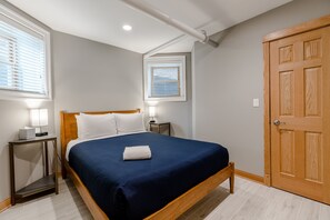 The master bedroom has a queen sized bed